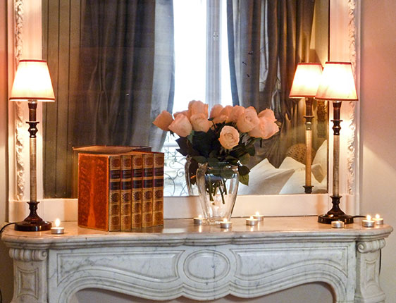 30-pink-roses-softly-lit-on-fireplace-web